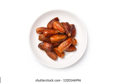 Top view of dried Date palm fruits in white plate isolate on white background with clipping path.