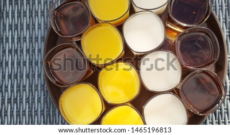 top view of drinks orange juice, tea, and milk