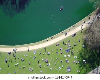 Top View Drone Shot In A Park In Brussels. On This Sunny Day There Were A Lot Of People Out Having A Picnic Next To The Pond