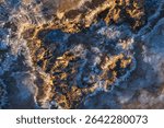 Top view to dry salt pond on cost near sea, shoreline. Texture background