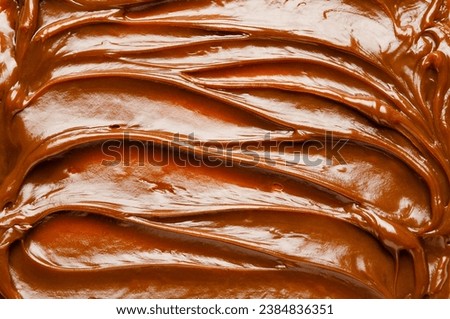 Top view of dulce de leche texture. Horizontal format. 
