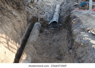 top view, earth pit, pipe system, water supply system, large pipe, repairing broken water pipe