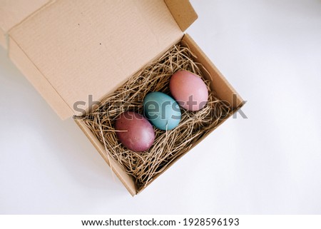 Top view of easter eggs in a cardboard box