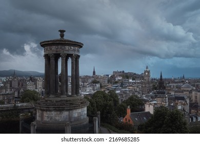 Top view of Edinburgh city centre in Scottish cloudy weather. Cityscape of the monument to Dugald Stewart, Edinburgh, Scotland, United Kingdom