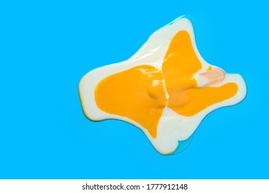 top view egg shape popsicle melted on blue background - Shutterstock ID 1777912148