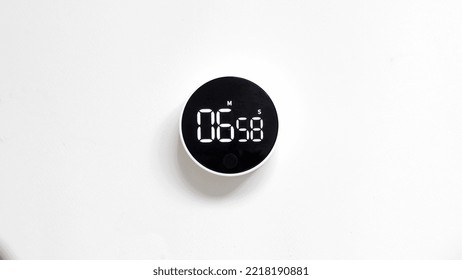 Top view. Electronic timer isolated on white background. Time is running out. - Powered by Shutterstock