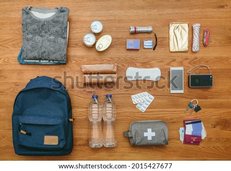 Top view of emergency backpack set with necessities