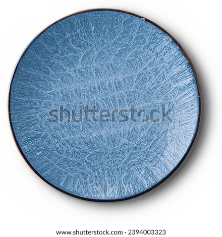 Top view of empty blue porcelain plate on white background