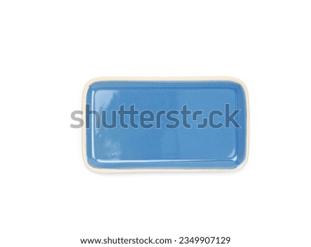 Top view, empty blue rectangle ceramic plate isolated on a white background. Use for home or restaurant, food design. Kitchen accessory. 