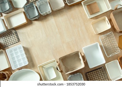 Top View Of Empty Closet Organization Boxes And Steel Wire Baskets In Different Shape Placed On White Marble Table With Copy Space. Marie Kondo’s Hikidashi Boxes For Tidying Clothes And Drawer Storage