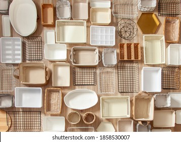 Top View Of Empty Closet Organization Boxes And Steel Wire Baskets In Different Shape Placed On White Marble Table With Copy Space. Marie Kondo’s Hikidashi Boxes For Tidying Clothes And Drawer Storage