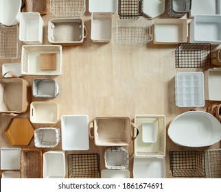 Top View Of Empty Closet Organization Boxes And Steel Wire Baskets In Different Shape Placed On White Marble Table With Copy Space. Marie Kondo’s Hikidashi Boxes For Tidying Clothes And Drawer Storage