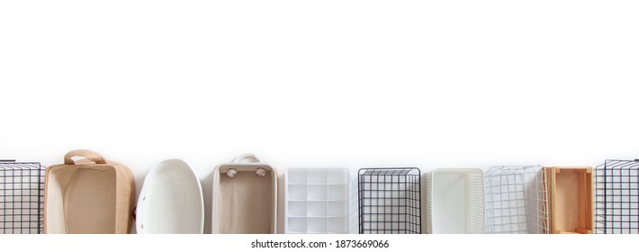 Top View Of Empty Closet Organization Boxes And Steel Wire Baskets In Different Shape Placed On White Marble Table With Copy Space. Marie Kondo’s Hikidashi Boxes For Tidying Clothes And Drawer Storage