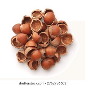 Top view of empty cracked hazelnut shells isolated on white