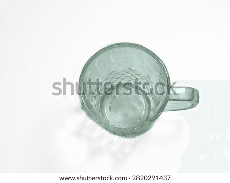 Top View of Empty Glass Mug with Diamond Pattern on White Background
