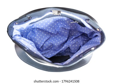 Top View Of Empty Handcrafted Soft Leather Handbag With Blue Dotted Lining Isolated On White Background