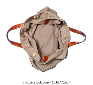 Top View Of Empty Handcrafted Travel Handbag Made From Leather And Canvas Tarp Isolated On White Background