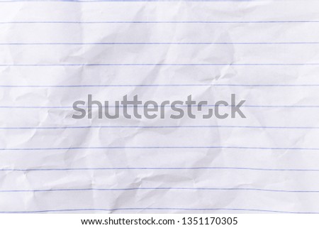Top view empty lined paper with wrinkled background and texture.