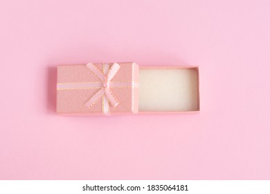 Top View Of Empty Open Gift Box For Congratulations On Pink Background. Top View, Flat Lay, Copy Space Concept.