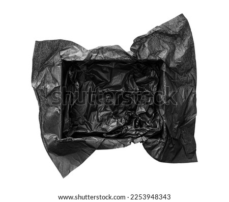 Top view of empty open gift box with black color silk paper filling inside. Luxury present wrapping or products background. Isolated on white, studio shot.