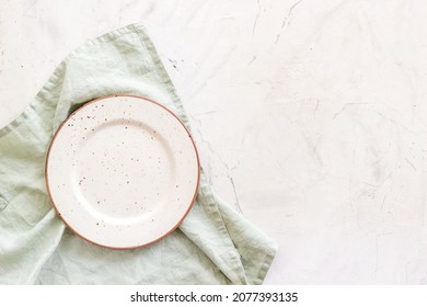 Top View Of Empty Plate On Napkin. Table Setting For Dinner