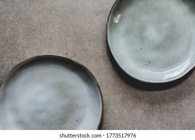 Top view of empty rustic grey plates