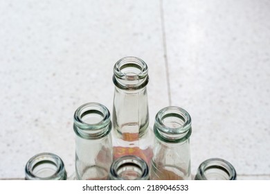 Top View Of Empty Soft Drinks Glass Bottles On The Floor. Close Up. Recycled Glass Concept.