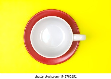 Top View Of The Empty White Coffee Or Tea Cup With Red Dish Vibrant Color Background