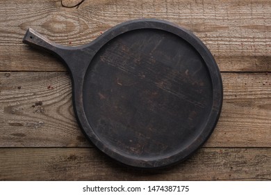 Top View Of Empty Woode Pizza Pan On Textured Table