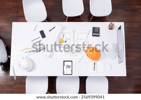 Top view empty workspace table for civil engineer and architectural construction development with paperwork and equipment for civil engineering background. Prudent
