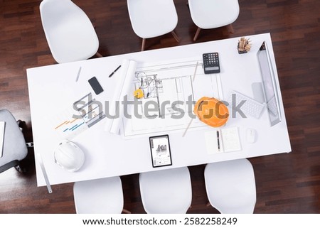 Top view empty workspace table for civil engineer and architectural construction development with paperwork and equipment for civil engineering background. Prudent