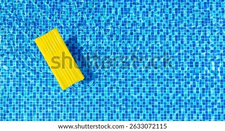 Top view empty yellow Inflatable raft floating in swimming pool