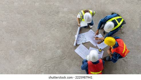 Top view of engineer, architect, contractor and foreman meeting at the construction building site with floor plan for real estate development project industry and housing timeline usage