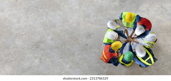 Top view of engineer, architect, contractor and foreman having unity agreement meeting at the construction building site with floor plan for real estate development project industry and housing usage