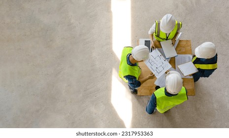 top view engineer discuss meeting together with architect foreman team while inspecting material of infrastructure construction progress for sustainable green building at site preparation copy space