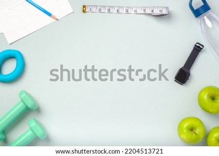 top view exercise stuff on green purple table for healty lifestyle