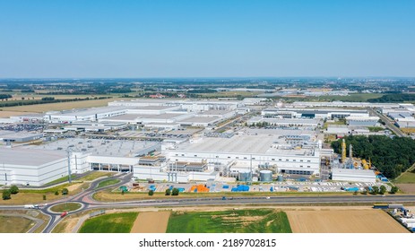 Top View Of Factory Premises, Industrial Plant Or Logistics Center. Large Industrial Buildings From Above