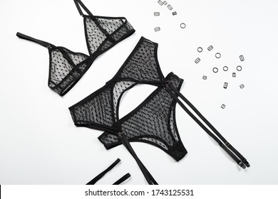Top view fashion black lace lingerie. Set of woman essential accessory and underwear on flat lay.
