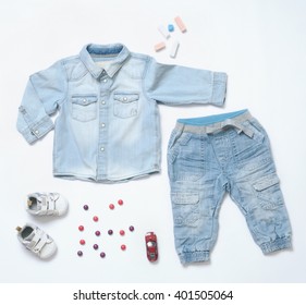 Top View Fashion Trendy Look Of Baby Clothes And Toy Stuff