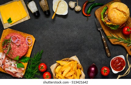 Top View Of Fast Food Ingredients, With Minced Meat, Bacon, French Fries And Burger Sandwich