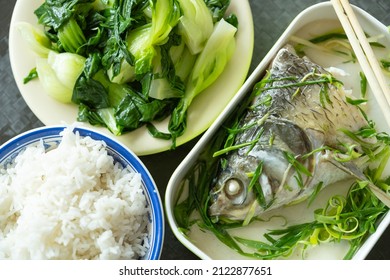 Top View Fast Food Of Steamed Fish And Vegetable And Rice At Horizontal Composition