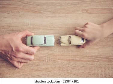 Top View Of Father And Son Playing With Toy Cars While Spending Time Together At Home