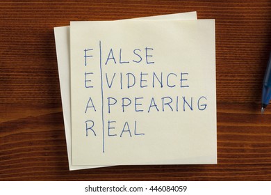 Top View Of F.E.A.R. Or False Evidence Appearing Real Written Note.