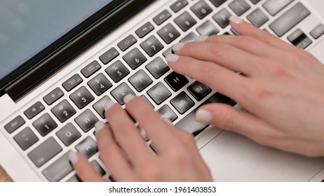 Top View Of Female Hands Typing On Laptop, Close Up