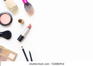 Top View Of Female Table With Makeup Including Lipsticks, Eye Palette, Foundation, Brushes And Others. Flat Lay, Image.