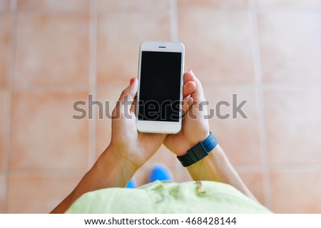 Top view of female using mobile phone, mock up screen background