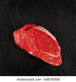 Top View Of Filet Mignon Isolated On Black Background.