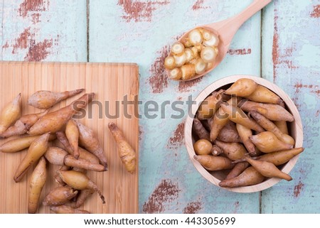 Top view of Finger root on wooden background
