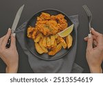 top view fish chips plate with woman holding cutlery