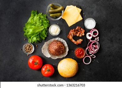 Top View And Flat Lay Of Burger Ingredients And Sauce On Black Table.